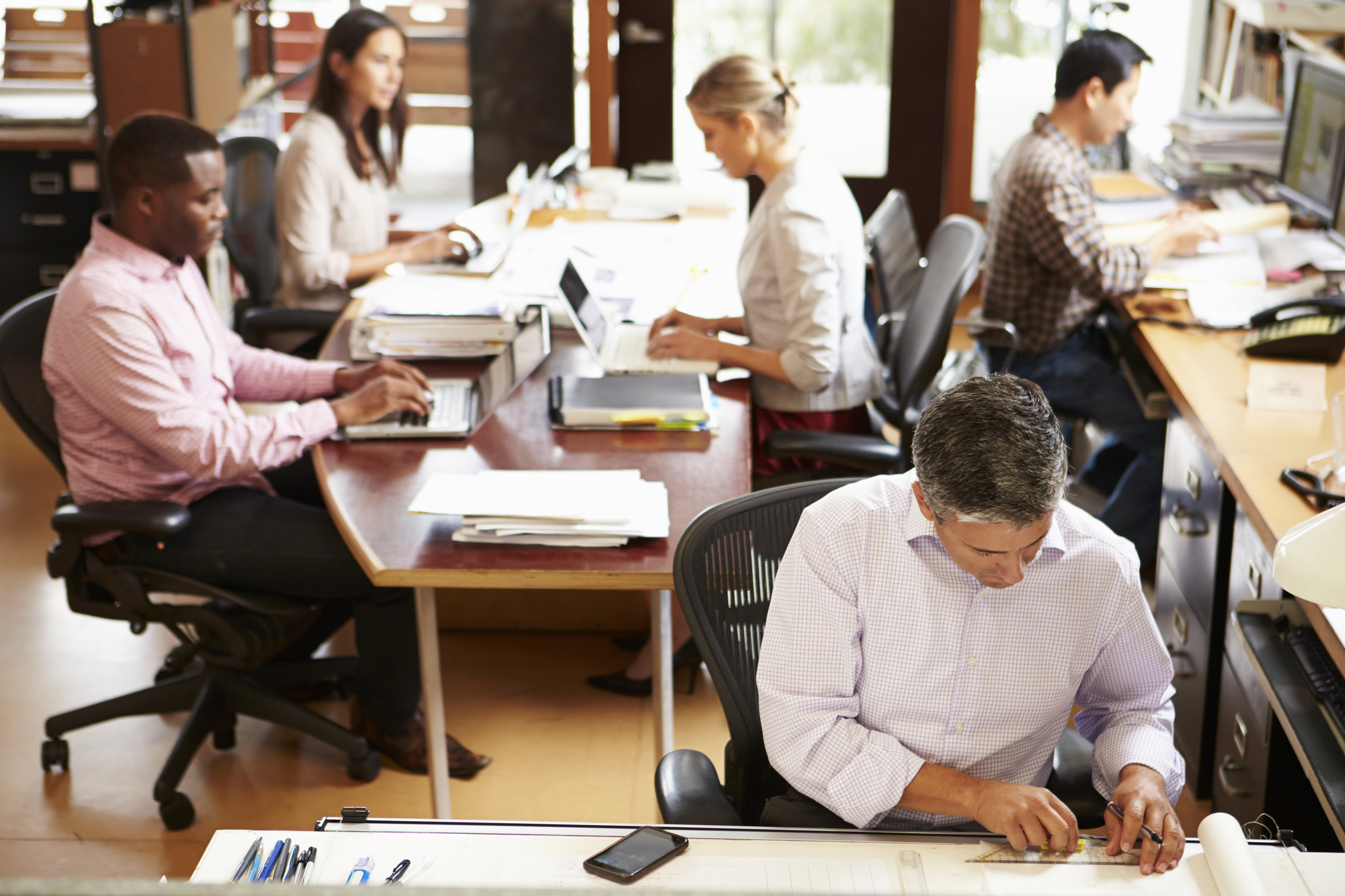 interior-of-busy-architect-s-office-with-staff-working-38629059